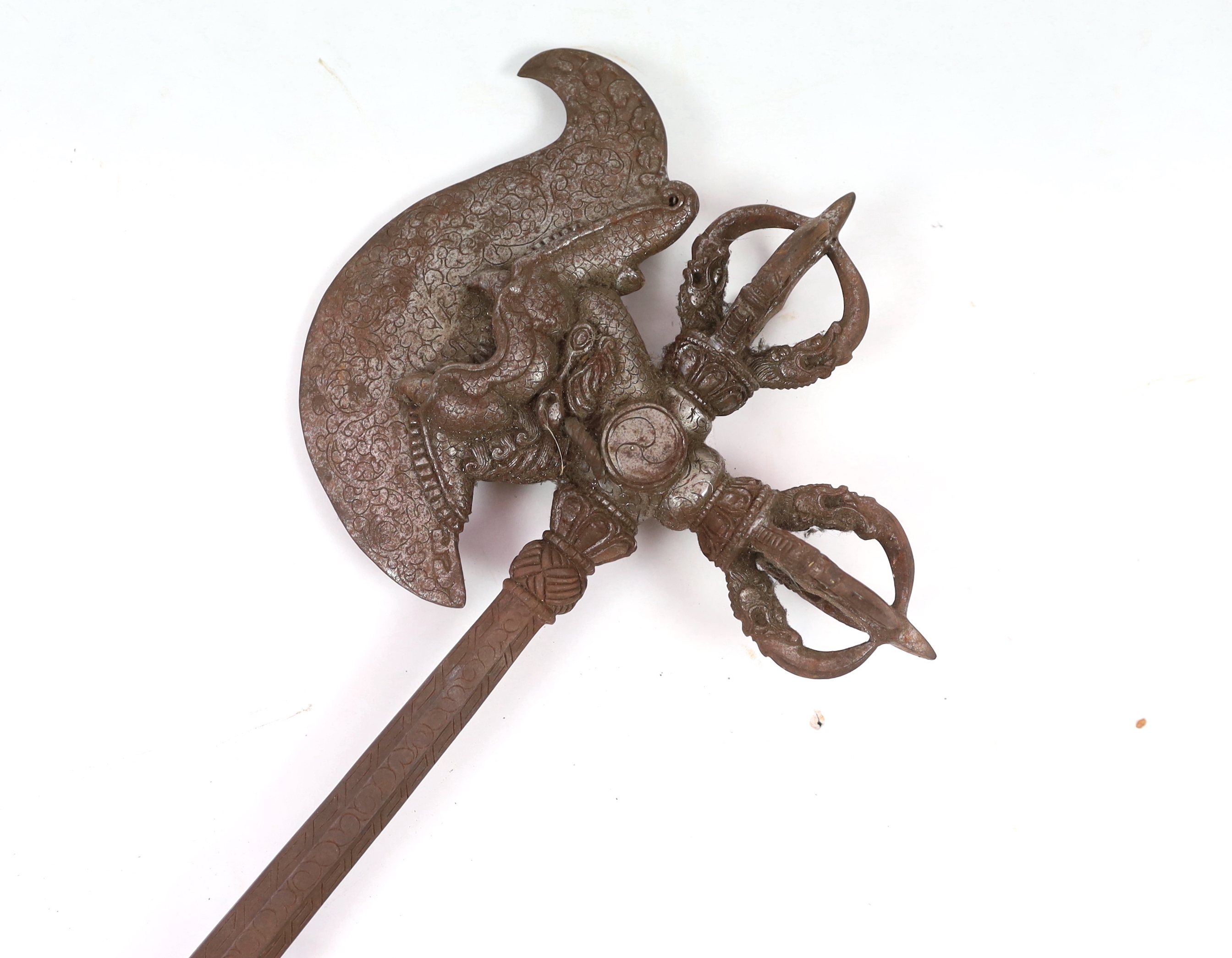 An ornate Buddhist iron axe, 91cm long